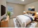 Cozy bedroom featuring a comfortable bed, soft lighting, and stylish decor at 508 Stone River Pkwy, Mount Holly, NC 28120