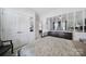 Bright bedroom with an electronic piano on a chest of drawers beneath mirrored panels at 5239 Admirals Lndg, Lancaster, SC 29720