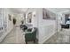 Inviting hallway features decorative wall paneling, artwork, and French doors to a connected room at 5239 Admirals Lndg, Lancaster, SC 29720
