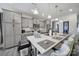 Spacious kitchen featuring gray cabinets, stainless steel appliances, and an island with barstool seating at 5239 Admirals Lndg, Lancaster, SC 29720
