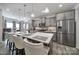Modern kitchen with stainless steel appliances, gray cabinetry, and a large center island with seating at 5239 Admirals Lndg, Lancaster, SC 29720