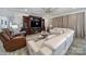 Elegant living room featuring a large entertainment center, modern furniture, and stylish decor at 5239 Admirals Lndg, Lancaster, SC 29720