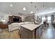 Open-concept living space featuring a modern kitchen island, living room and dining area with lots of natural light at 5239 Admirals Lndg, Lancaster, SC 29720