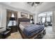 Spacious main bedroom featuring a tray ceiling, sitting area, and plush furnishings at 5239 Admirals Lndg, Lancaster, SC 29720