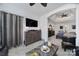 Cozy sitting area with a ceiling fan and large dresser that transitions to the main bedroom at 5239 Admirals Lndg, Lancaster, SC 29720