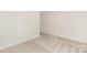Minimalist bedroom with neutral carpet and a door leading to another room at 8465 Old Plank Rd, Charlotte, NC 28216