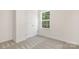 Bedroom offers bright neutral walls, carpeted floor, closet and natural lighting at 8465 Old Plank Rd, Charlotte, NC 28216