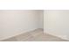 Neutral carpet fills an empty bedroom with white walls and base molding detail at 8465 Old Plank Rd, Charlotte, NC 28216