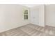 Bright bedroom features soft carpet, natural light from the window and a closet at 8465 Old Plank Rd, Charlotte, NC 28216