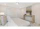 Tastefully decorated bedroom with soft carpet, console table, and neutral decor at 8465 Old Plank Rd, Charlotte, NC 28216