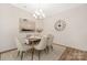 Elegant dining room featuring modern decor, a stylish chandelier, and ample seating for entertaining guests at 8465 Old Plank Rd, Charlotte, NC 28216