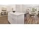 Bright, open kitchen featuring an island with bar seating flowing into a dining area and living space at 8465 Old Plank Rd, Charlotte, NC 28216
