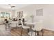 Comfortable living room combined with dining area, featuring neutral tones, stylish furnishings and bright natural light at 8465 Old Plank Rd, Charlotte, NC 28216
