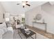 Spacious living room with hardwood floors, comfortable seating, and a modern design with plenty of natural light at 8465 Old Plank Rd, Charlotte, NC 28216