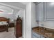 This primary bathroom features an elegant granite counter, faucet, and cabinets at 9900 Silverling Dr, Waxhaw, NC 28173