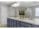 Bright bathroom with a double vanity, a large mirror, and modern fixtures at 9900 Silverling Dr, Waxhaw, NC 28173