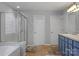 A bathroom featuring a glass shower, a toilet, and a double sink at 9900 Silverling Dr, Waxhaw, NC 28173