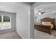 A lovely bedroom features an expansive bed with a ceiling fan and plush carpet at 9900 Silverling Dr, Waxhaw, NC 28173
