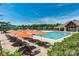 Resort-style community pool with ample seating, waterslide, and a clear blue sky at 9900 Silverling Dr, Waxhaw, NC 28173