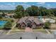 Stunning exterior view of the community clubhouse with brick facade and manicured landscaping at 9900 Silverling Dr, Waxhaw, NC 28173