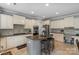 Spacious kitchen boasts an island with seating, stainless appliances, and ample cabinet space at 9900 Silverling Dr, Waxhaw, NC 28173
