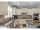 Charming kitchen featuring granite counters, stainless appliances and plenty of natural light at 9900 Silverling Dr, Waxhaw, NC 28173