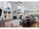 Spacious living room featuring soaring ceilings, a fireplace, and large windows for natural light at 9900 Silverling Dr, Waxhaw, NC 28173