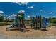 Community playground featuring slides, climbing structures, and a soft, safe play surface at 9900 Silverling Dr, Waxhaw, NC 28173