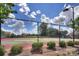 Community tennis court featuring a net, enclosed fence, and surrounded by greenery at 9900 Silverling Dr, Waxhaw, NC 28173