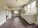 Kitchen with modern cabinets and dark laminate flooring at 112 Aiken St, Chester, SC 29706