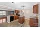 Well-lit kitchen with wooden cabinets and an island provides plenty of prep and cooking space at 11210 Northwoods Forest Dr, Charlotte, NC 28214