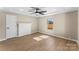 Comfortable bedroom with ceiling fan, brick fireplace, and neutral paint color at 1202 Guinn Ave, Kannapolis, NC 28083