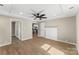 Spacious living room with brick fireplace, recessed lighting, and hardwood floors at 1202 Guinn Ave, Kannapolis, NC 28083