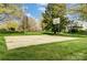 An outdoor basketball court surrounded by lush greenery, offering recreational opportunities at 1207 Chadbourne Ave, Concord, NC 28027