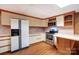 Partial basement kitchen with stainless steel appliances and bar-style seating at 1207 Chadbourne Ave, Concord, NC 28027