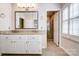 Bathroom showcases a dual sink vanity, granite counters, and a walk-in shower at 1207 Chadbourne Ave, Concord, NC 28027