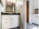 Bathroom featuring a modern vanity with a granite countertop and decorative backsplash at 1207 Chadbourne Ave, Concord, NC 28027