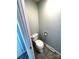 Toilet with light blue wall and light beige flooring in bathroom at 1207 Chadbourne Ave, Concord, NC 28027