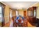 Elegant dining room with chandelier, hardwood floors, and traditional furniture at 1207 Chadbourne Ave, Concord, NC 28027