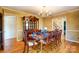 Formal dining room with hardwood floors, a decorative chandelier, and elegant furnishings at 1207 Chadbourne Ave, Concord, NC 28027