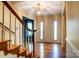 Inviting foyer with hardwood floors, staircase, and bright natural light at 1207 Chadbourne Ave, Concord, NC 28027