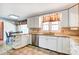 Bright kitchen with tiled flooring, stainless steel appliances, and eat-in area at 1207 Chadbourne Ave, Concord, NC 28027
