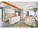 Spacious kitchen with white cabinetry, granite countertops, and an island at 1207 Chadbourne Ave, Concord, NC 28027