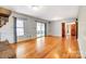 Large living room with hardwood floors and plenty of natural light from windows and sliding glass door at 1207 Chadbourne Ave, Concord, NC 28027