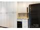 Spacious pantry with white cabinets, granite countertop, and modern appliances at 1207 Chadbourne Ave, Concord, NC 28027