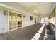 Spacious screened-in porch with ceiling fans and ample lighting at 1207 Chadbourne Ave, Concord, NC 28027