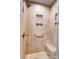 Stylish shower area with tiled walls, built-in shelving niches and seat at 1207 Chadbourne Ave, Concord, NC 28027