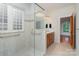 Bright bathroom features a glass-enclosed shower and a well-lit vanity area at 125 Cherokee Dr, Mooresville, NC 28117