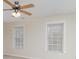 Bedroom with two large windows, neutral walls, carpet and ceiling fan at 125 Cherokee Dr, Mooresville, NC 28117