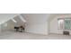 Wide angle of finished Bonus Room with large windows, storage chest, and carpet at 125 Cherokee Dr, Mooresville, NC 28117